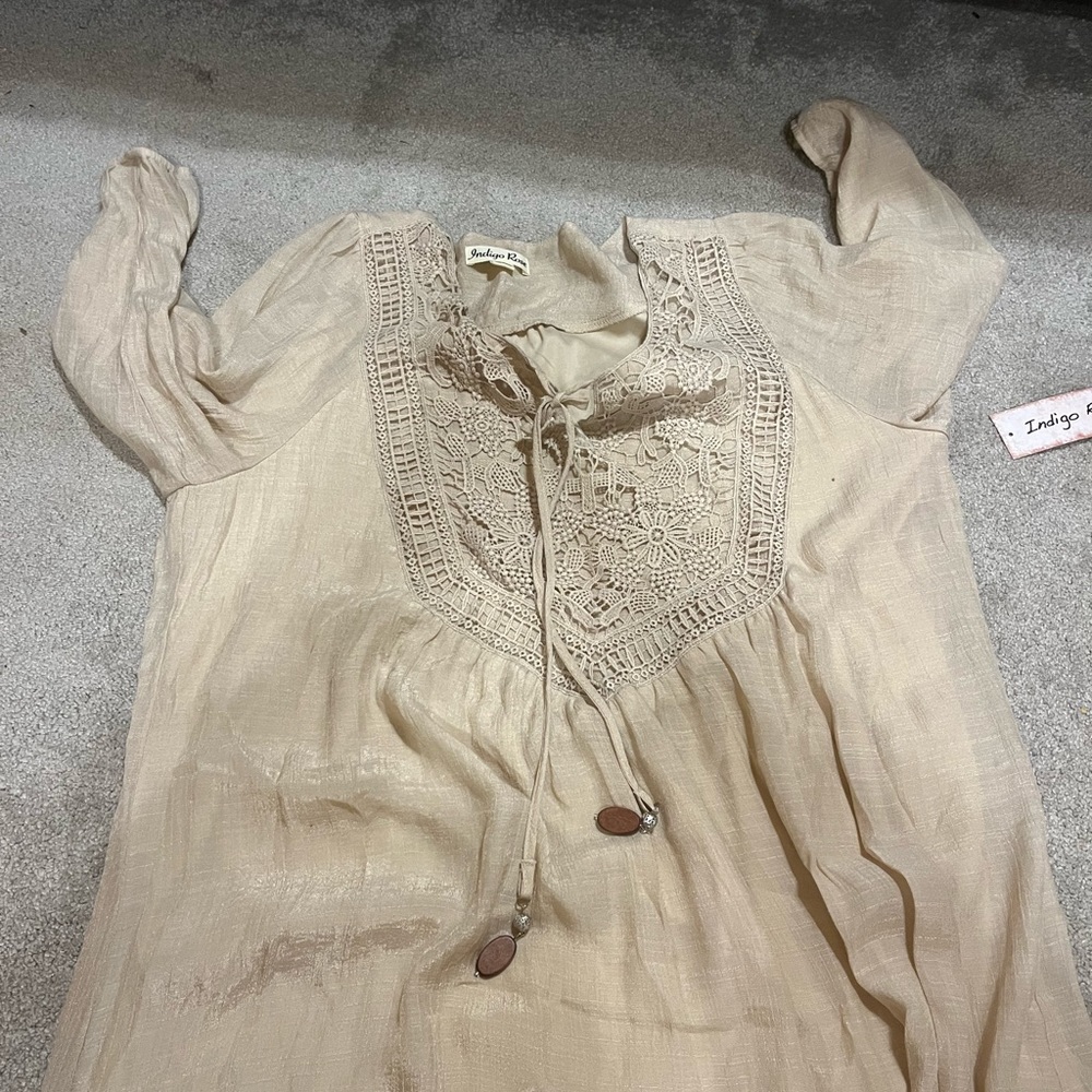 Brand new dress with tags, mid length with jewelry ties
